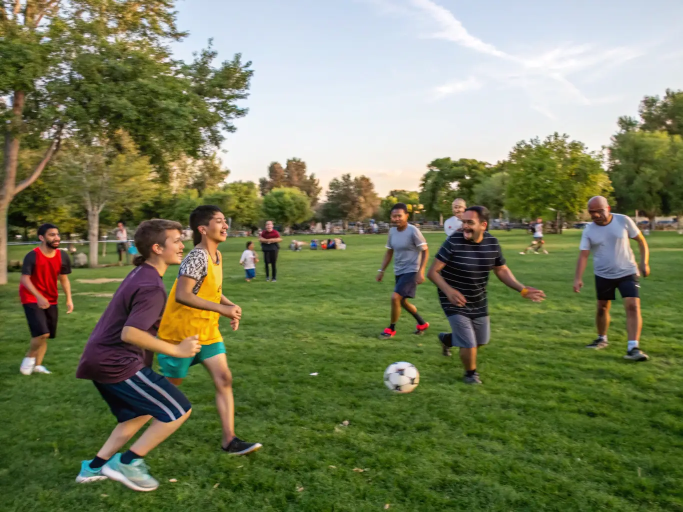 A dynamic image of a group participating in a community sports day, highlighting teamwork, physical activity, and the spirit of friendly competition.